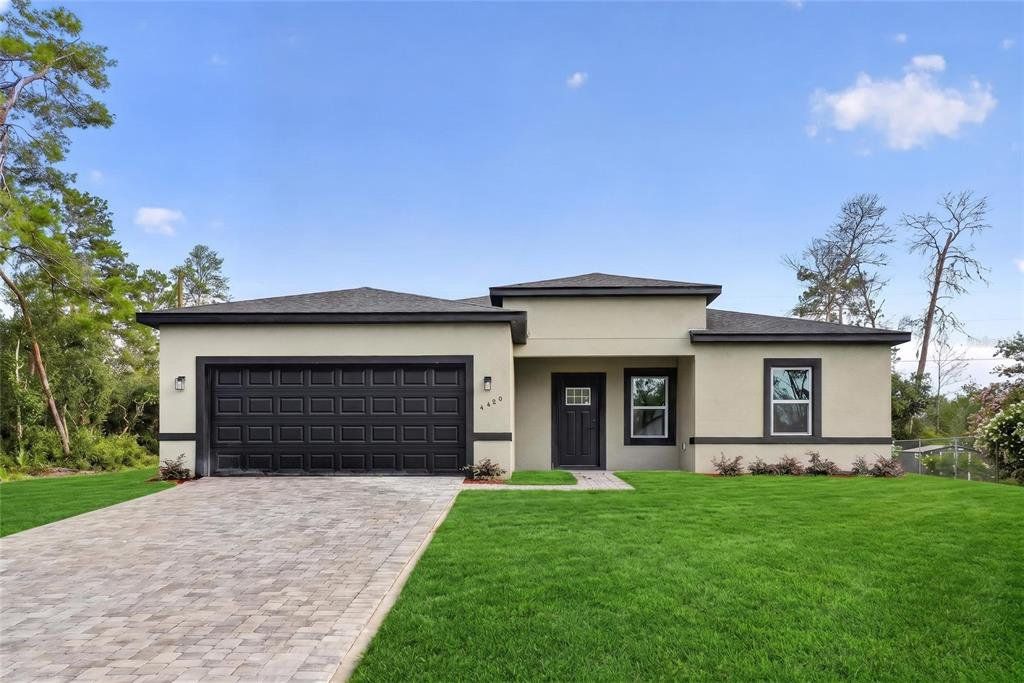 Front exterior of a new home in , Ocala, FL, highlighting curb appeal (Image 1). Front exterior of a new home in , Ocala, FL, highlighting curb appeal (Image 1).