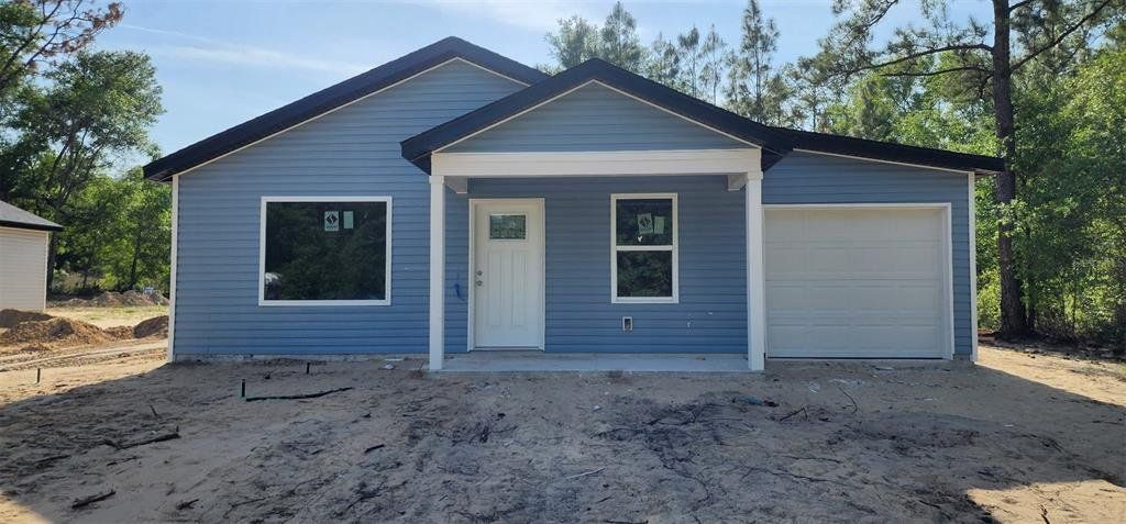 Front exterior of a new home in , Ocala, FL, highlighting curb appeal (Image 1). Front exterior of a new home in , Ocala, FL, highlighting curb appeal (Image 1).