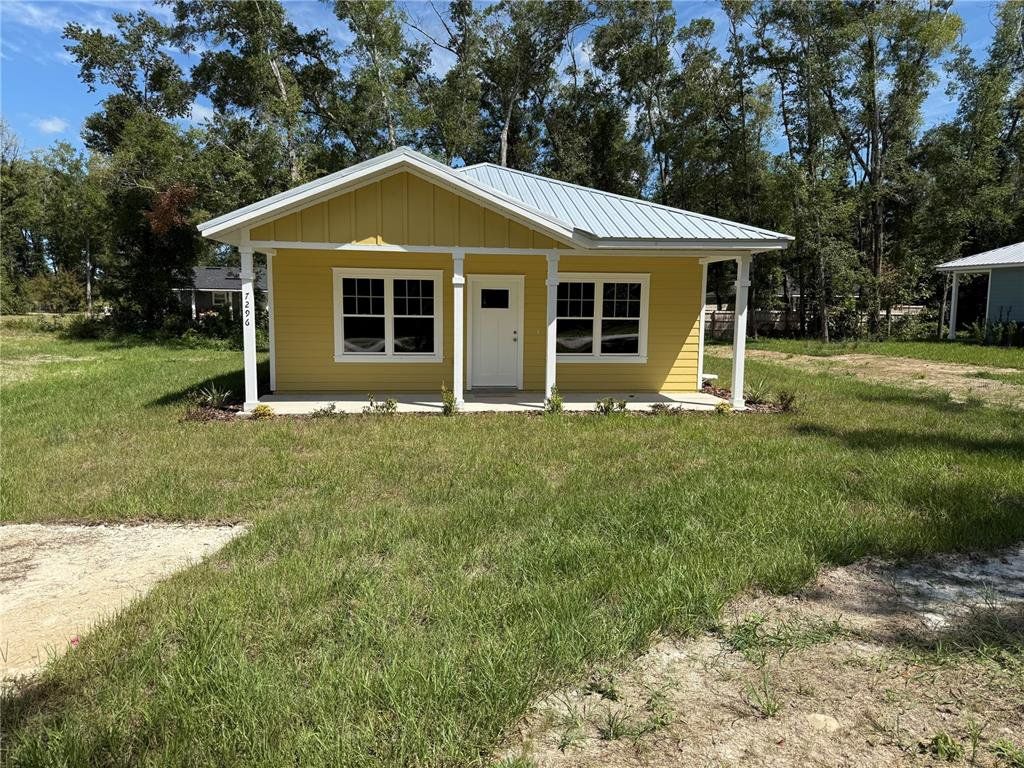 Front exterior of a new home in , Trenton, FL, highlighting curb appeal (Image 1). Front exterior of a new home in , Trenton, FL, highlighting curb appeal (Image 1).
