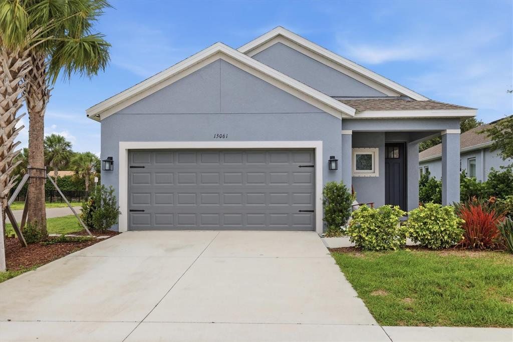 Front exterior of a new home in Palmero, Nokomis, FL, highlighting curb appeal (Image 1). Front exterior of a new home in Palmero, Nokomis, FL, highlighting curb appeal (Image 1).