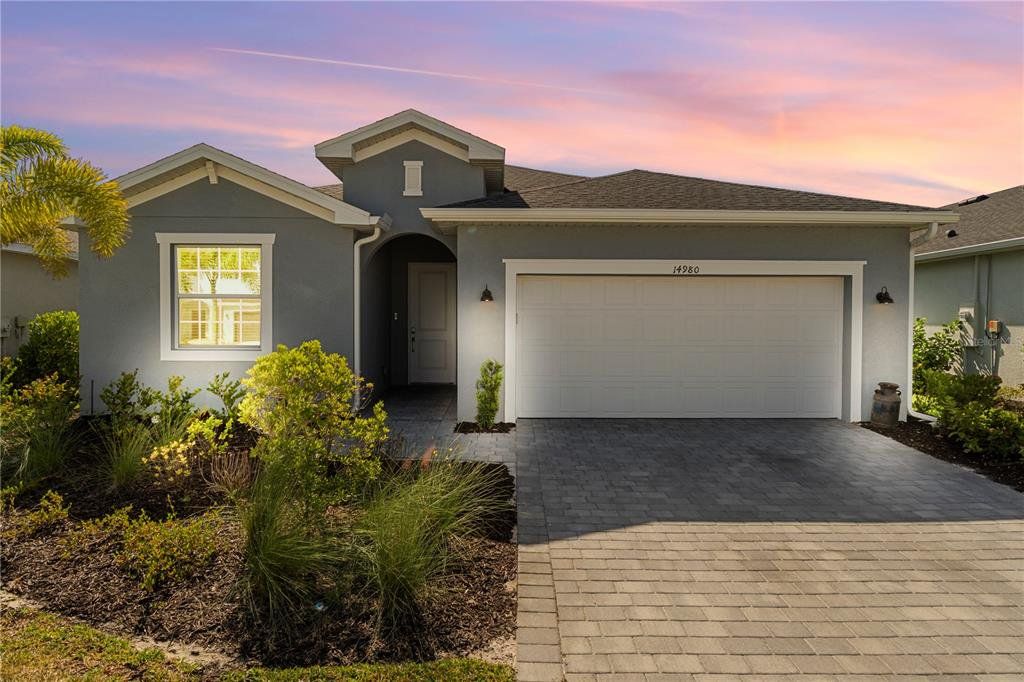Front exterior of a new home in , Punta Gorda, FL, highlighting curb appeal (Image 1). Front exterior of a new home in , Punta Gorda, FL, highlighting curb appeal (Image 1).