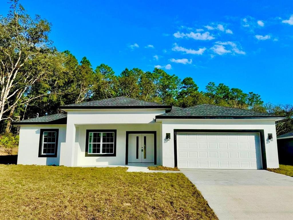 Front exterior of a new home in , Dunnellon, FL, highlighting curb appeal (Image 1). Front exterior of a new home in , Dunnellon, FL, highlighting curb appeal (Image 1).