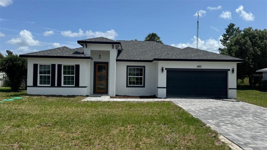Front exterior of a new home in , Ocala, FL, highlighting curb appeal (Image 1). Front exterior of a new home in , Ocala, FL, highlighting curb appeal (Image 1).