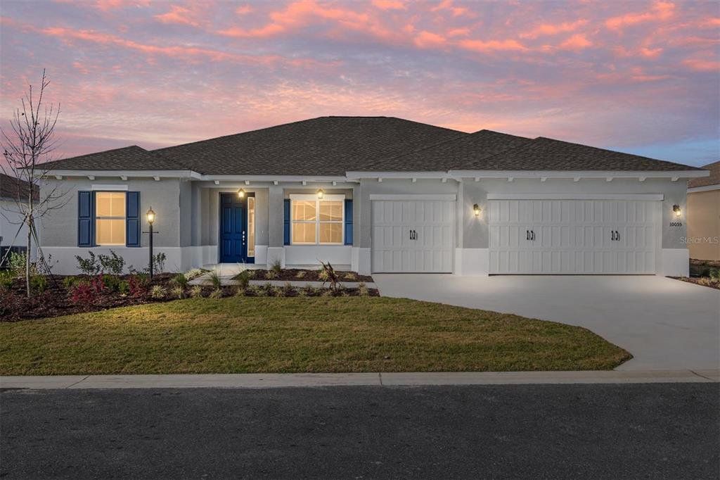 Front exterior of a new home in On Top of the World Communities, Ocala, FL, highlighting curb appeal (Image 1). Front exterior of a new home in On Top of the World Communities, Ocala, FL, highlighting curb appeal (Image 1).