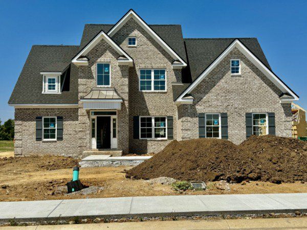 Front exterior of a new home in The Maples, Murfreesboro, TN, highlighting curb appeal (Image 1).