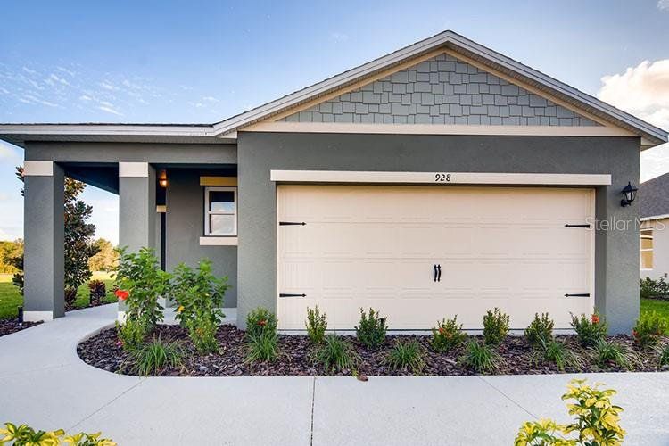 Front exterior of a new home in Kindred, Kissimmee, FL, highlighting curb appeal (Image 1). Front exterior of a new home in Kindred, Kissimmee, FL, highlighting curb appeal (Image 1).