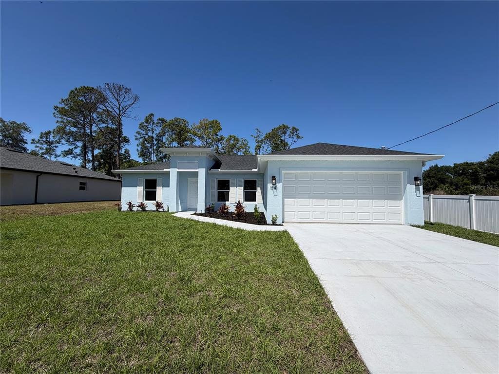 Front exterior of a new home in , North Port, FL, highlighting curb appeal (Image 1). Front exterior of a new home in , North Port, FL, highlighting curb appeal (Image 1).