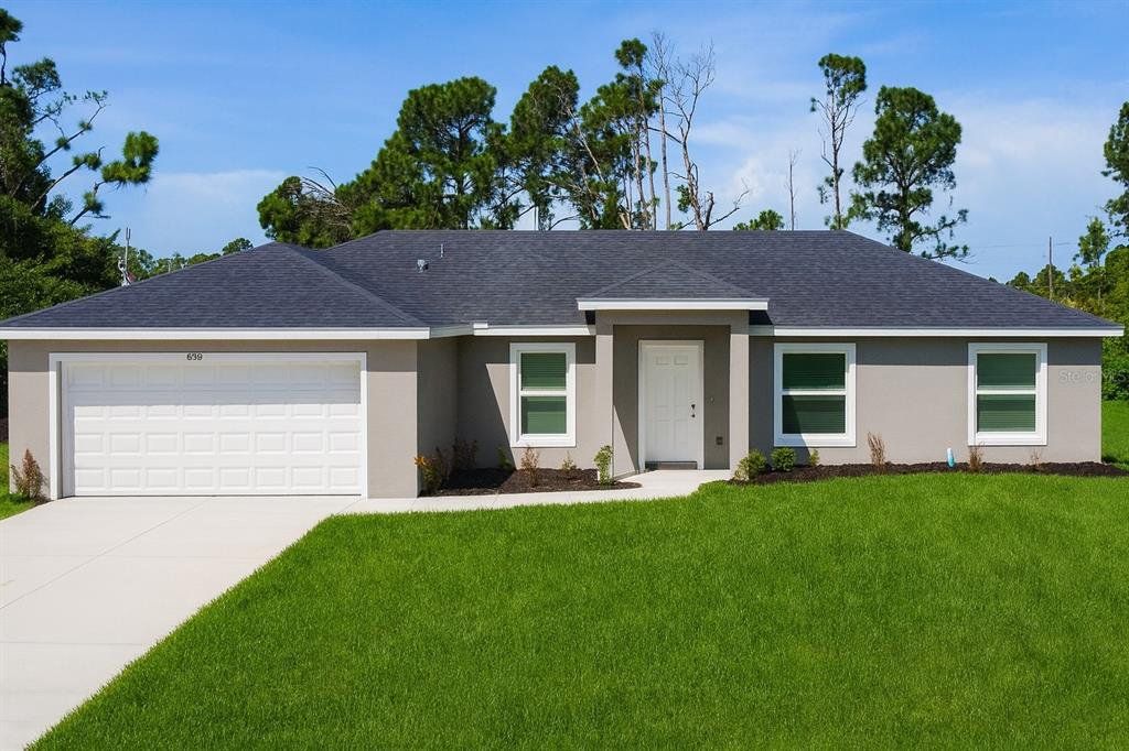 Front exterior of a new home in , Port Charlotte, FL, highlighting curb appeal (Image 1).