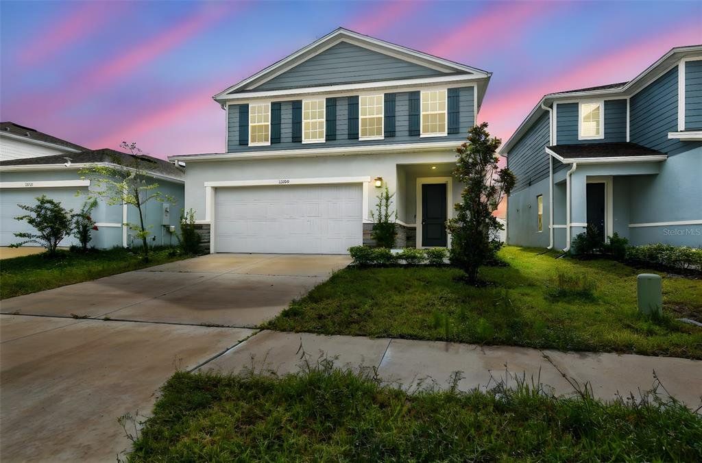 Front exterior of a new home in , Spring Hill, FL, highlighting curb appeal (Image 1). Front exterior of a new home in , Spring Hill, FL, highlighting curb appeal (Image 1).