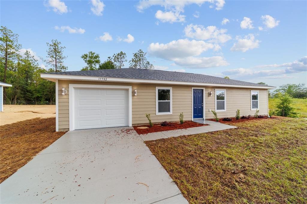 Front exterior of a new home in , Dunnellon, FL, highlighting curb appeal (Image 1). Front exterior of a new home in , Dunnellon, FL, highlighting curb appeal (Image 1).