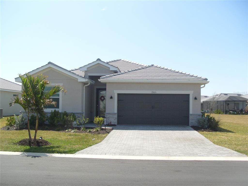 Front exterior of a new home in , Port Charlotte, FL, highlighting curb appeal (Image 1). Front exterior of a new home in , Port Charlotte, FL, highlighting curb appeal (Image 1).