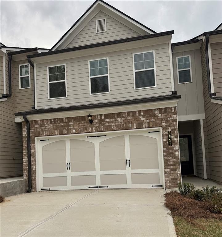 Front exterior of a new home in Mulberry Summit, Flowery Branch, GA, highlighting curb appeal (Image 1). Front exterior of a new home in Mulberry Summit, Flowery Branch, GA, highlighting curb appeal (Image 1).