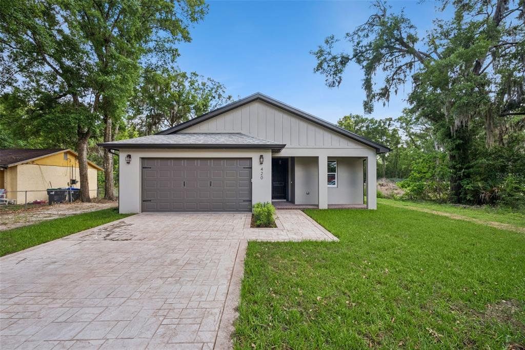Front exterior of a new home in , Apopka, FL, highlighting curb appeal (Image 1). Front exterior of a new home in , Apopka, FL, highlighting curb appeal (Image 1).