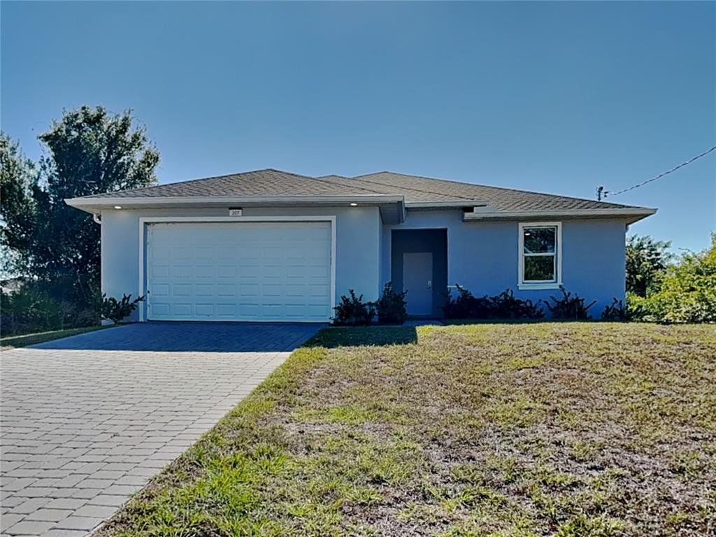 Front exterior of a new home in , Rotonda West, FL, highlighting curb appeal (Image 1). Front exterior of a new home in , Rotonda West, FL, highlighting curb appeal (Image 1).