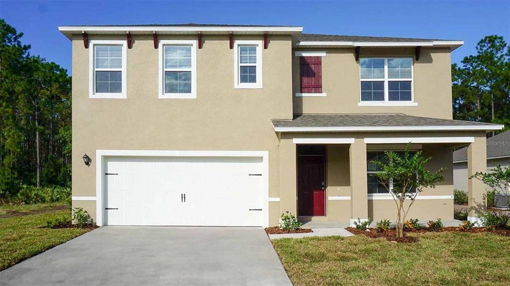 Front exterior of a new home in Wynwood, Ocoee, FL, highlighting curb appeal (Image 1). Front exterior of a new home in Wynwood, Ocoee, FL, highlighting curb appeal (Image 1).
