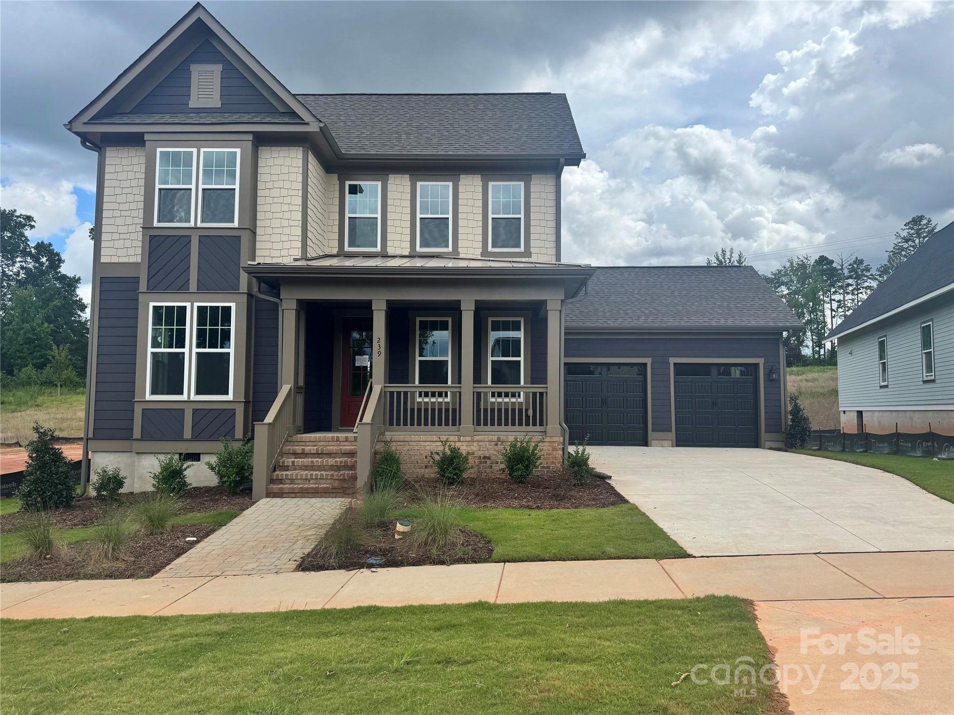 Front exterior of a new home in Riverwalk, Rock Hill, SC, highlighting curb appeal (Image 1). Front exterior of a new home in Riverwalk, Rock Hill, SC, highlighting curb appeal (Image 1).