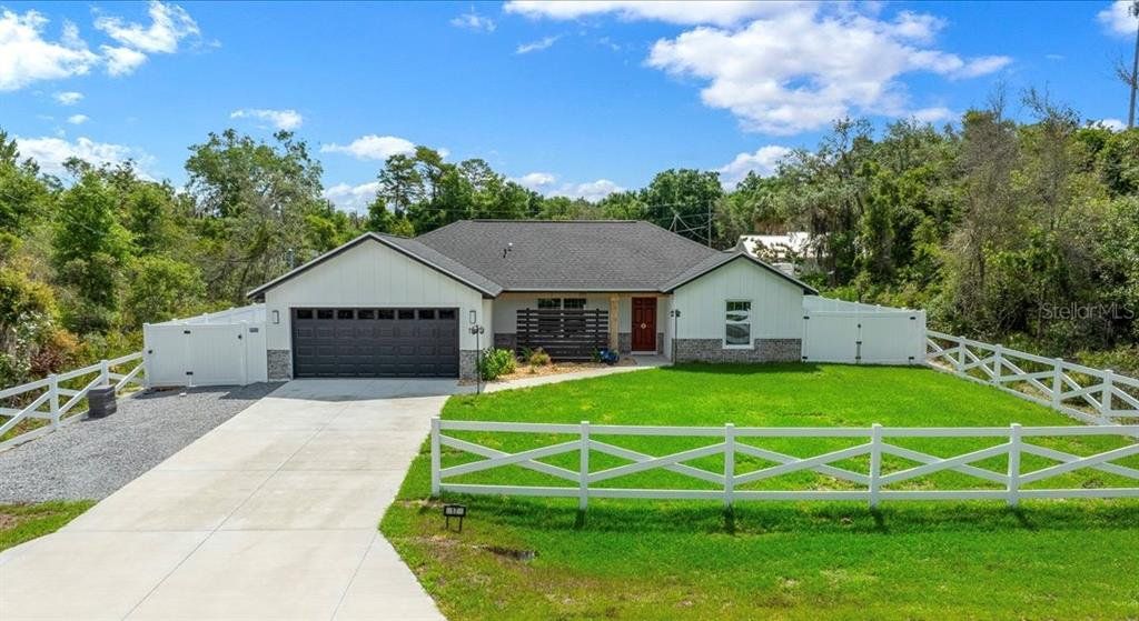 Front exterior of a new home in , Ocala, FL, highlighting curb appeal (Image 1). Front exterior of a new home in , Ocala, FL, highlighting curb appeal (Image 1).