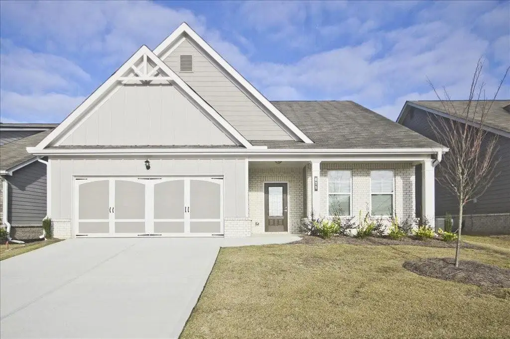 Front exterior of a new home in Cooper's Walk, Loganville, GA, highlighting curb appeal (Image 1). Front exterior of a new home in Cooper's Walk, Loganville, GA, highlighting curb appeal (Image 1).