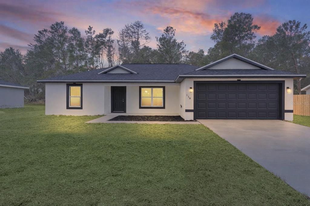 Front exterior of a new home in , Ocklawaha, FL, highlighting curb appeal (Image 1). Front exterior of a new home in , Ocklawaha, FL, highlighting curb appeal (Image 1).