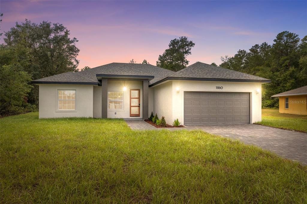 Front exterior of a new home in , Ocala, FL, highlighting curb appeal (Image 1). Front exterior of a new home in , Ocala, FL, highlighting curb appeal (Image 1).