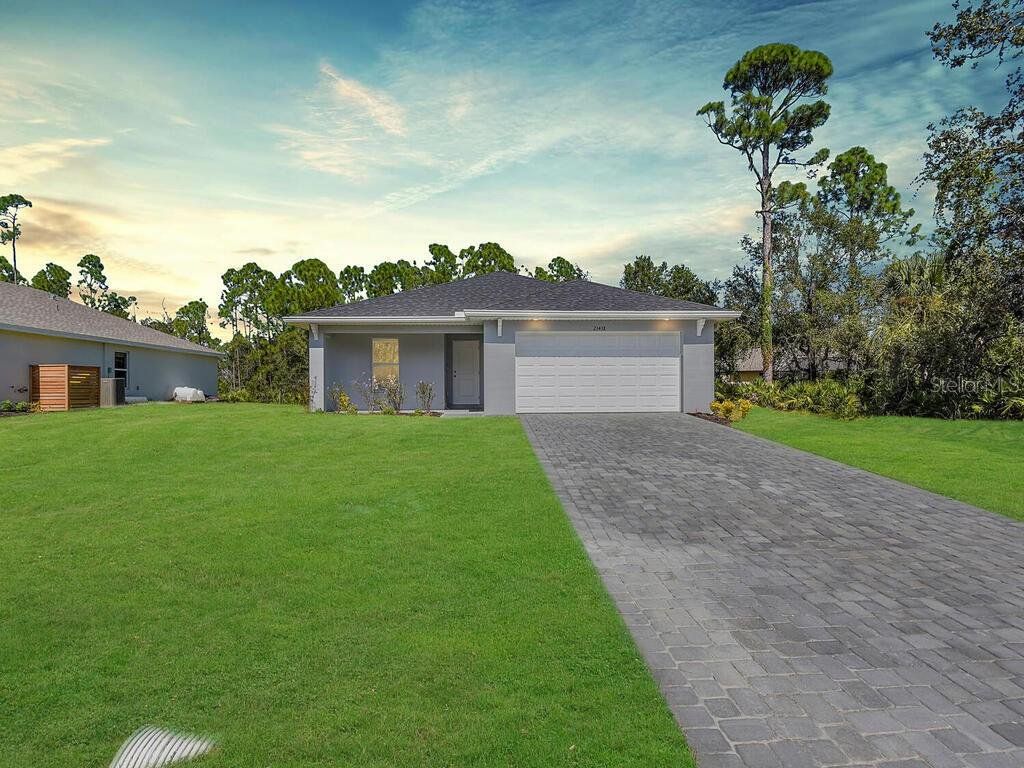 Front exterior of a new home in , Port Charlotte, FL, highlighting curb appeal (Image 1). Front exterior of a new home in , Port Charlotte, FL, highlighting curb appeal (Image 1).