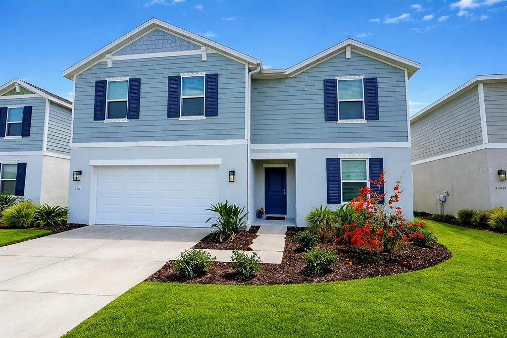 Front exterior of a new home in Broadleaf, Parrish, FL, highlighting curb appeal (Image 1). Front exterior of a new home in Broadleaf, Parrish, FL, highlighting curb appeal (Image 1).