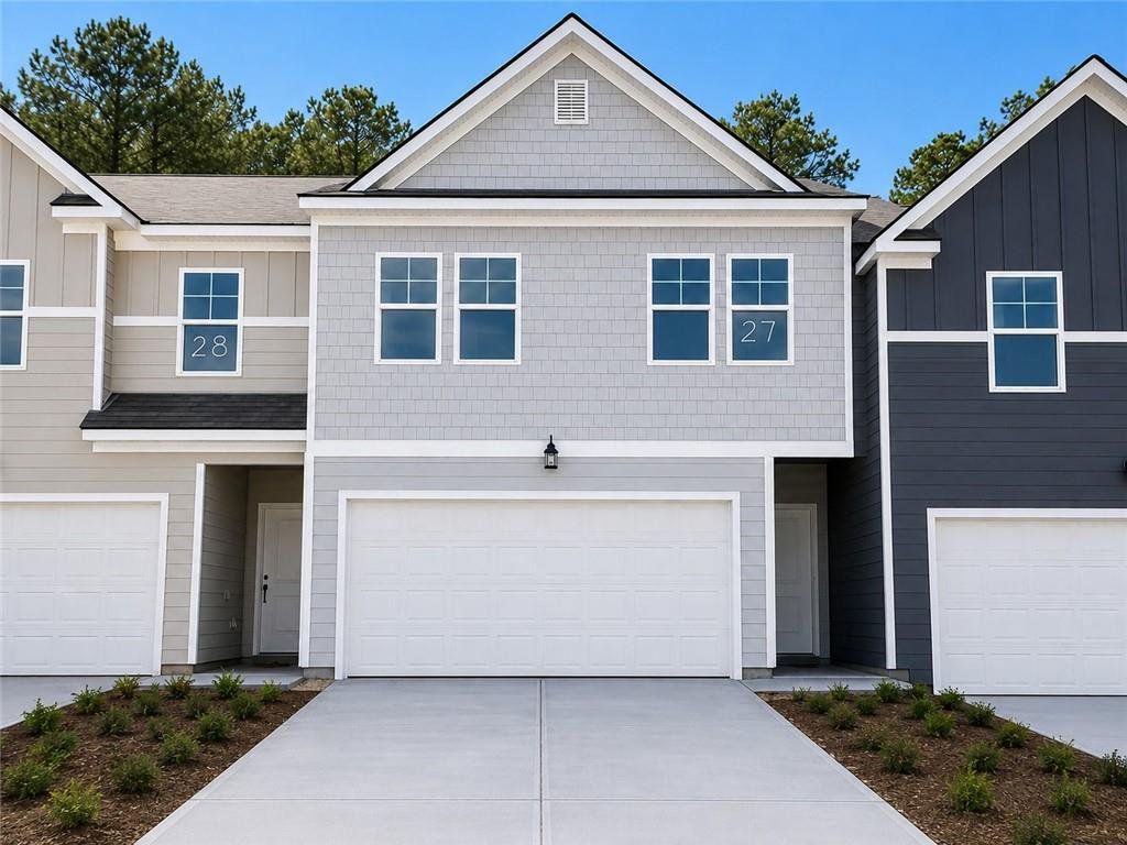 Front exterior of a new home in Rivershire Place, Villa Rica, GA, highlighting curb appeal (Image 1). Front exterior of a new home in Rivershire Place, Villa Rica, GA, highlighting curb appeal (Image 1).