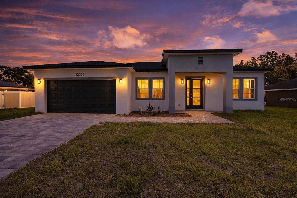 Front exterior of a new home in , Ocala, FL, highlighting curb appeal (Image 1). Front exterior of a new home in , Ocala, FL, highlighting curb appeal (Image 1).