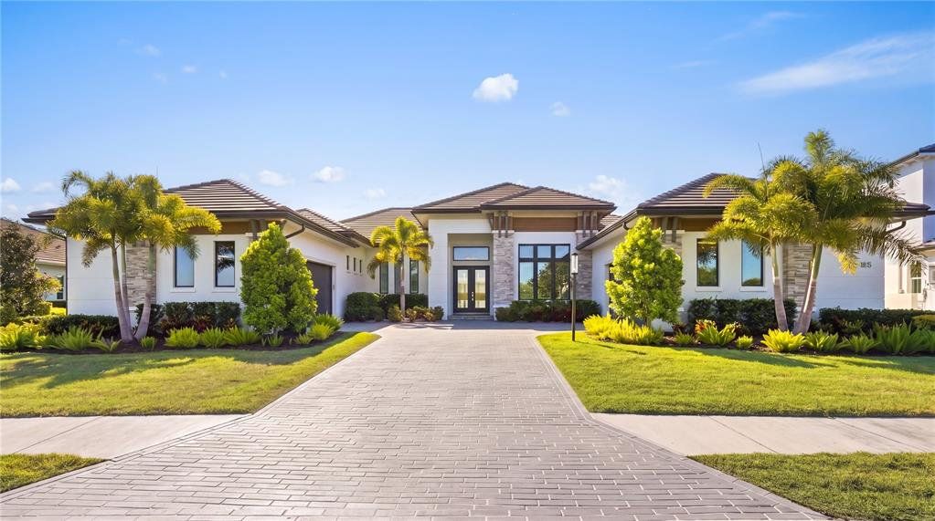 Front exterior of a new home in , Parrish, FL, highlighting curb appeal (Image 1). Front exterior of a new home in , Parrish, FL, highlighting curb appeal (Image 1).