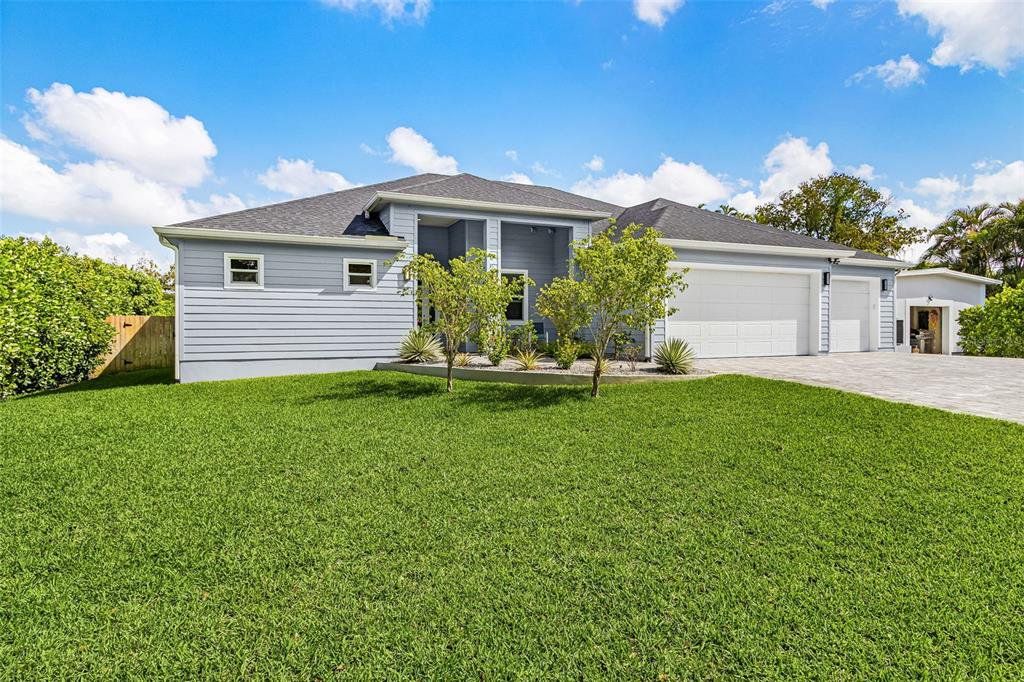 Front exterior of a new home in , Fort Myers, FL, highlighting curb appeal (Image 1). Front exterior of a new home in , Fort Myers, FL, highlighting curb appeal (Image 1).