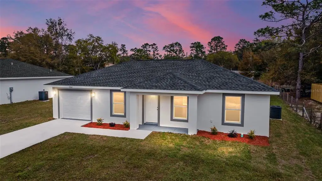Front exterior of a new home in , Ocala, FL, highlighting curb appeal (Image 1). Front exterior of a new home in , Ocala, FL, highlighting curb appeal (Image 1).