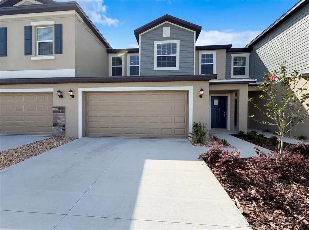 Front exterior of a new home in , Parrish, FL, highlighting curb appeal (Image 1). Front exterior of a new home in , Parrish, FL, highlighting curb appeal (Image 1).