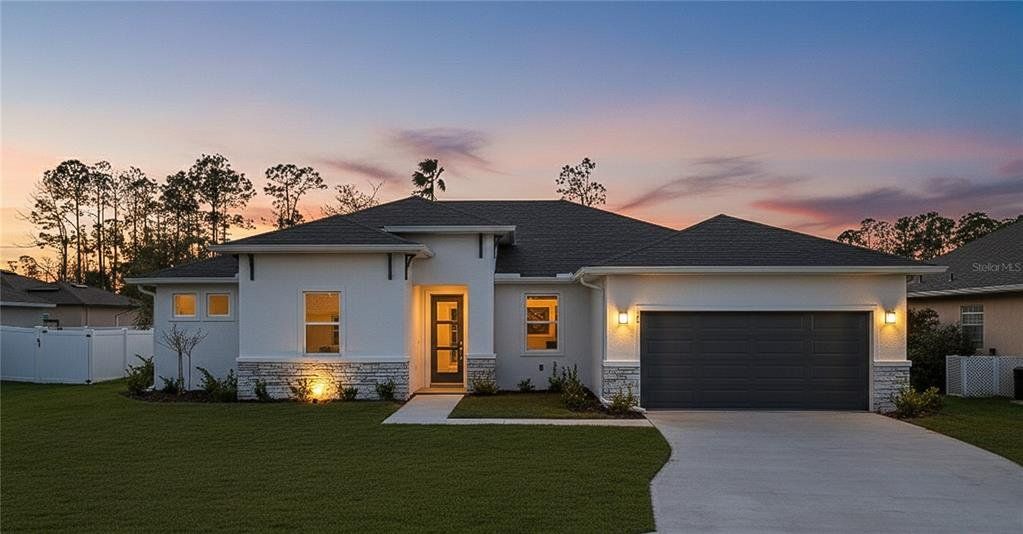 Front exterior of a new home in , Palm Coast, FL, highlighting curb appeal (Image 1). Front exterior of a new home in , Palm Coast, FL, highlighting curb appeal (Image 1).