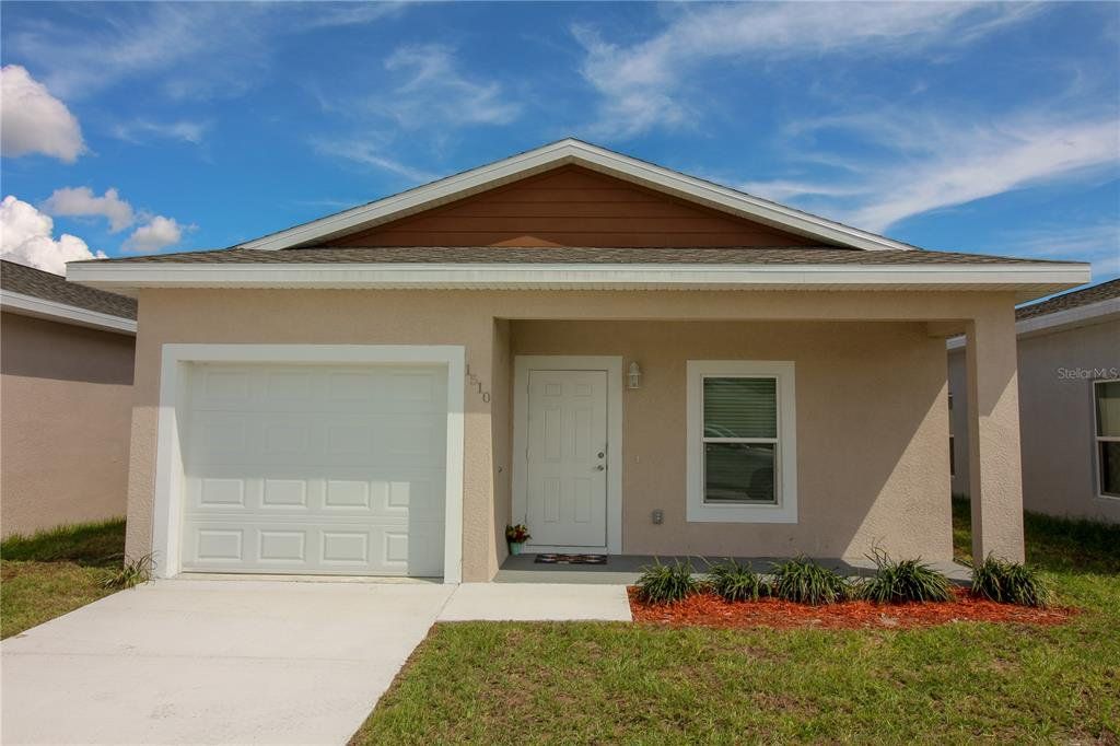 Front exterior of a new home in , Sebring, FL, highlighting curb appeal (Image 1). Front exterior of a new home in , Sebring, FL, highlighting curb appeal (Image 1).