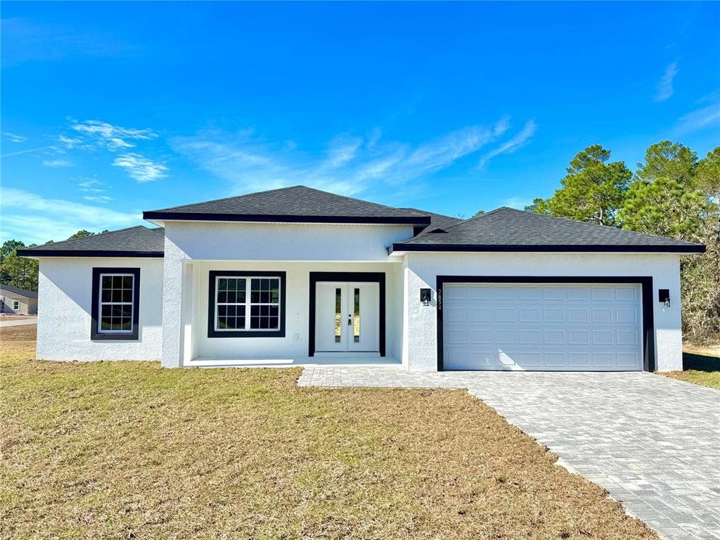 Front exterior of a new home in , Citrus Springs, FL, highlighting curb appeal (Image 1). Front exterior of a new home in , Citrus Springs, FL, highlighting curb appeal (Image 1).