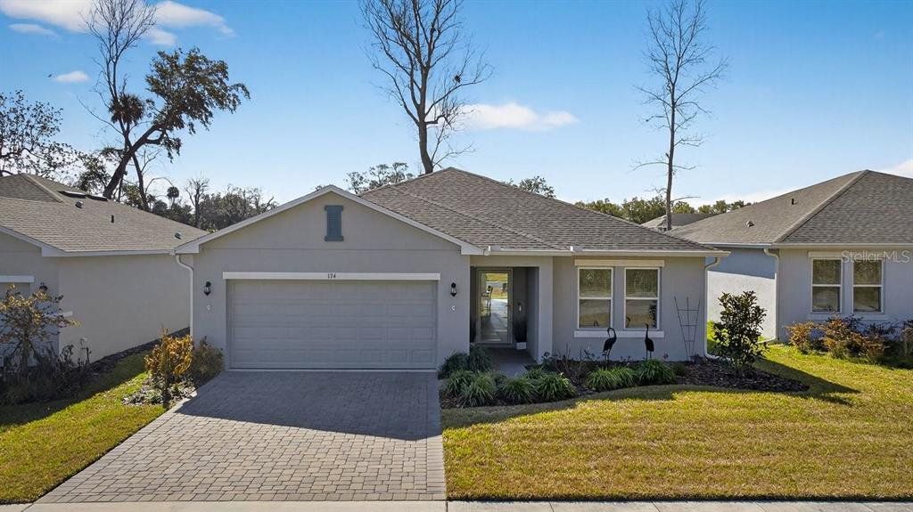 Front exterior of a new home in , Edgewater, FL, highlighting curb appeal (Image 1). Front exterior of a new home in , Edgewater, FL, highlighting curb appeal (Image 1).