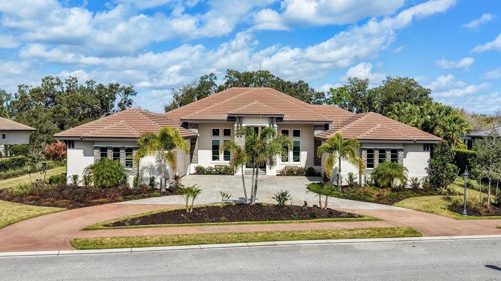 Front exterior of a new home in , Sarasota, FL, highlighting curb appeal (Image 1). Front exterior of a new home in , Sarasota, FL, highlighting curb appeal (Image 1).