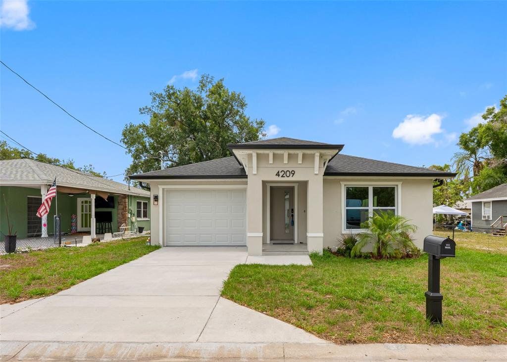 Front exterior of a new home in , Tampa, FL, highlighting curb appeal (Image 1). Front exterior of a new home in , Tampa, FL, highlighting curb appeal (Image 1).