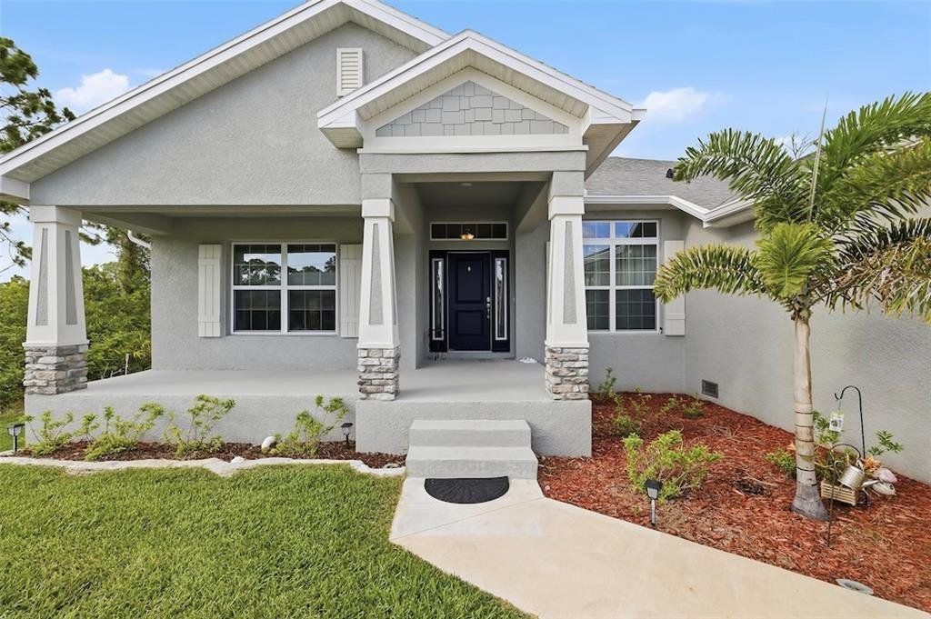 Front exterior of a new home in , Port Charlotte, FL, highlighting curb appeal (Image 1). Front exterior of a new home in , Port Charlotte, FL, highlighting curb appeal (Image 1).