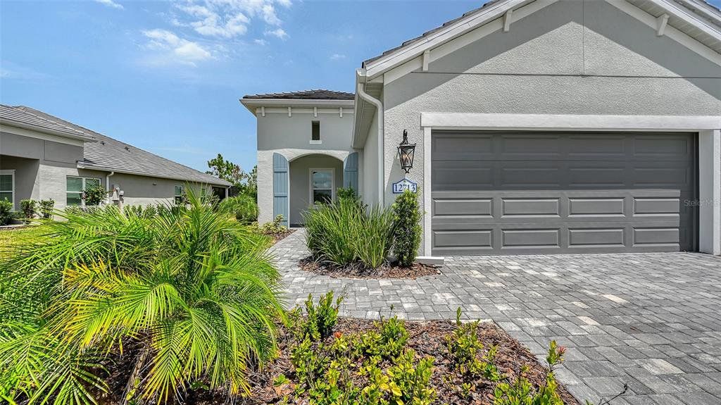 Front exterior of a new home in , Venice, FL, highlighting curb appeal (Image 1). Front exterior of a new home in , Venice, FL, highlighting curb appeal (Image 1).