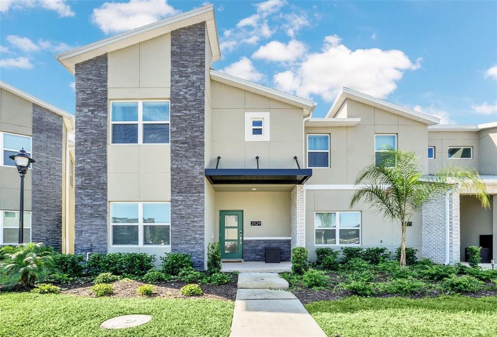 Front exterior of a new home in , Kissimmee, FL, highlighting curb appeal (Image 1). Front exterior of a new home in , Kissimmee, FL, highlighting curb appeal (Image 1).
