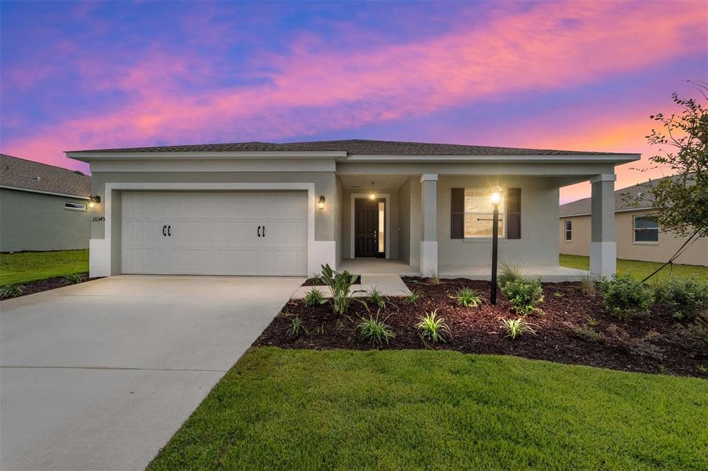 Front exterior of a new home in On Top of the World Communities, Ocala, FL, highlighting curb appeal (Image 1). Front exterior of a new home in On Top of the World Communities, Ocala, FL, highlighting curb appeal (Image 1).