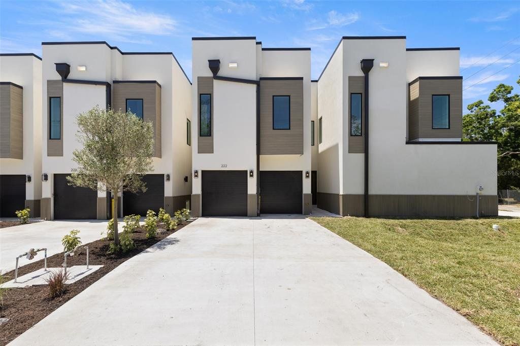 Front exterior of a new home in , Tampa, FL, highlighting curb appeal (Image 1). Front exterior of a new home in , Tampa, FL, highlighting curb appeal (Image 1).