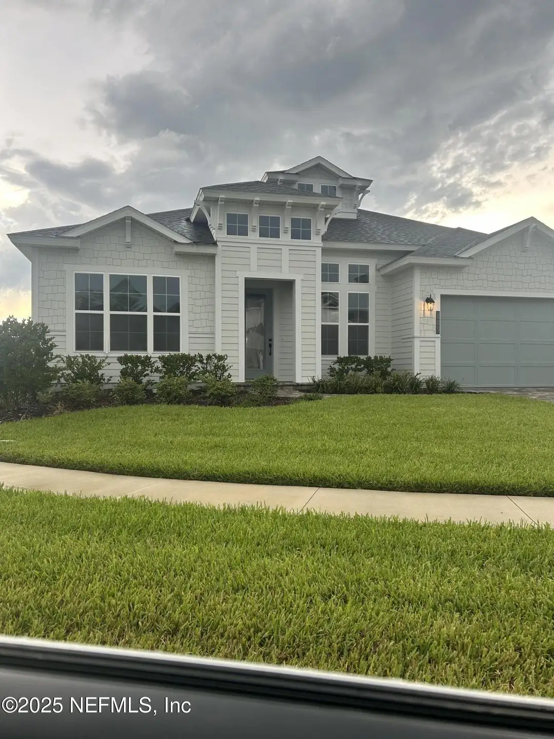 Front exterior of a new home in Reflections at Seabrook, Nocatee, FL, highlighting curb appeal (Image 1). Front exterior of a new home in Reflections at Seabrook, Nocatee, FL, highlighting curb appeal (Image 1).