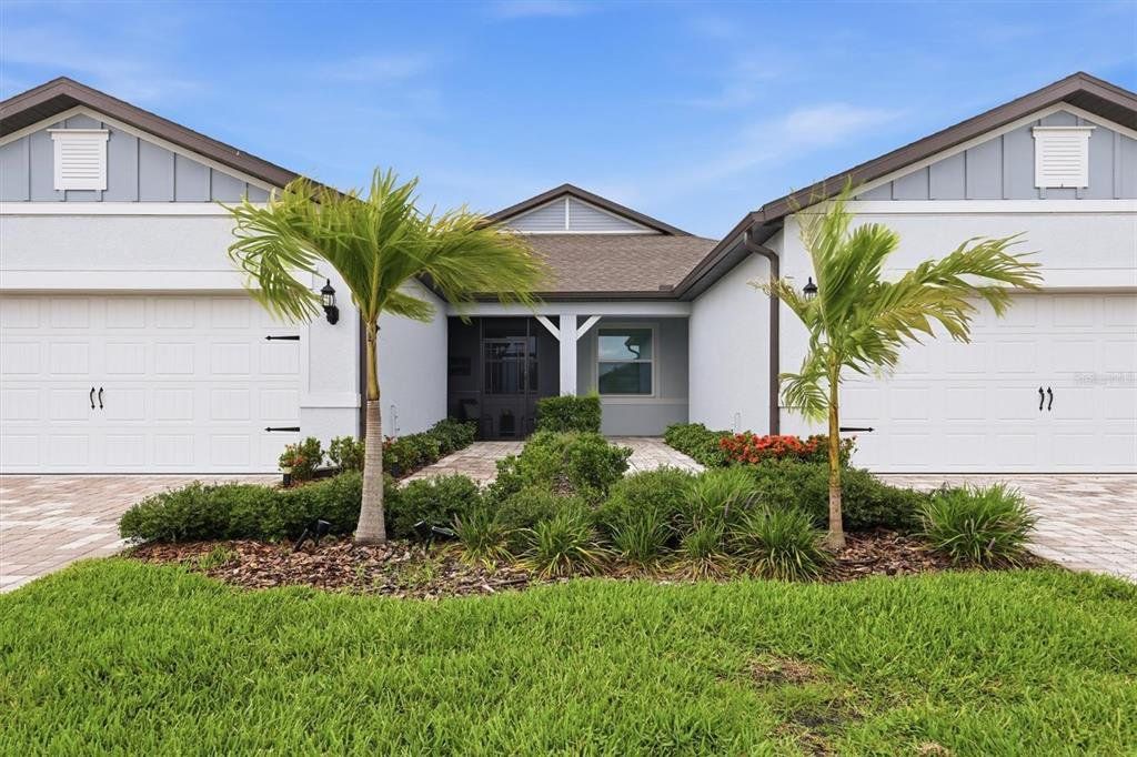 Front exterior of a new home in , Parrish, FL, highlighting curb appeal (Image 1). Front exterior of a new home in , Parrish, FL, highlighting curb appeal (Image 1).
