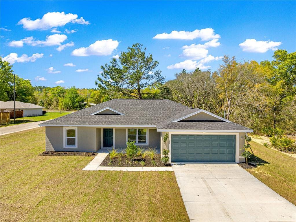 Front exterior of a new home in , Ocklawaha, FL, highlighting curb appeal (Image 1). Front exterior of a new home in , Ocklawaha, FL, highlighting curb appeal (Image 1).