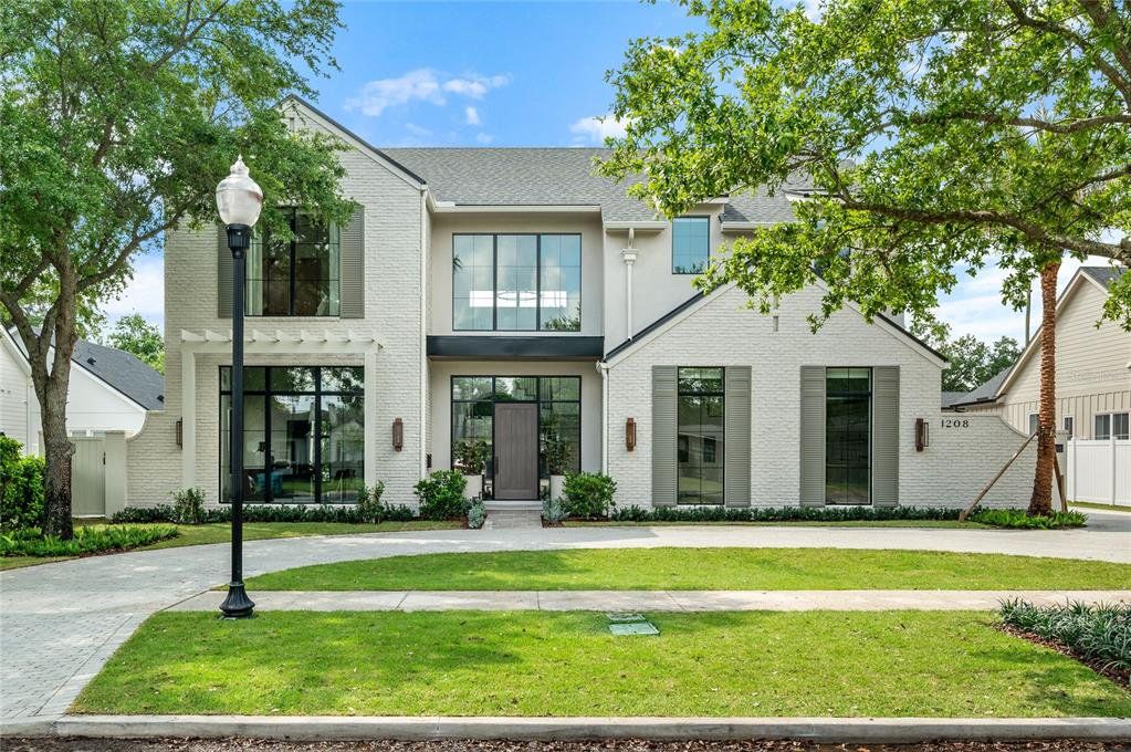 Front exterior of a new home in , Orlando, FL, highlighting curb appeal (Image 1). Front exterior of a new home in , Orlando, FL, highlighting curb appeal (Image 1).