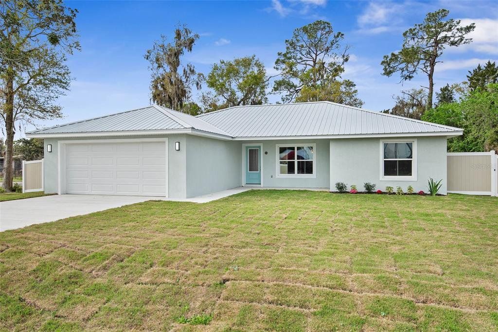 Front exterior of a new home in , Bunnell, FL, highlighting curb appeal (Image 1). Front exterior of a new home in , Bunnell, FL, highlighting curb appeal (Image 1).