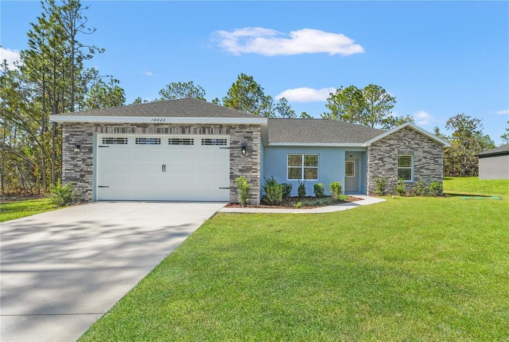 Front exterior of a new home in , Weeki Wachee, FL, highlighting curb appeal (Image 1). Front exterior of a new home in , Weeki Wachee, FL, highlighting curb appeal (Image 1).