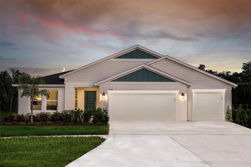Front exterior of a new home in Harmony at Lake Eloise, Winter Haven, FL, highlighting curb appeal (Image 1).